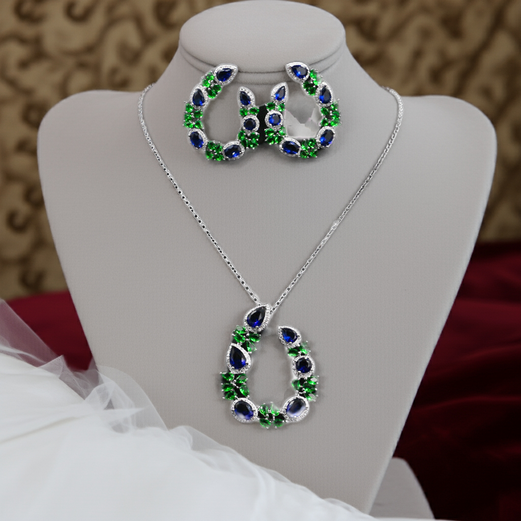 Jewelry set with necklace and earrings on a mannequin bust.